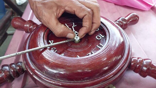 watchmaker Repair a wall clock