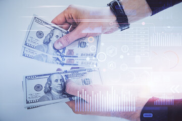 Multi exposure of technology drawing hologram and us dollars bills and man hands. Data concept