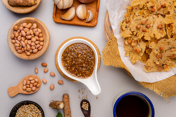 Rempeyek or peyek kacang is a deep-fried savoury Indonesian-Javanese cracker made from flour (usually rice flour) with peanut, lime leaves and other ingredients, bound or coated by crispy flour batter
