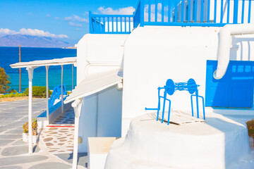 Blue wooden window frames and a well in Mykonos Island Greece Cyclades