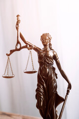 Justice and law concept.Male judge in a courtroom with the gavel, working with, computer and docking keyboard, eyeglasses, on table in morning light