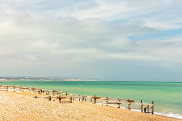 Sea scapes/landscapes by water showing blue summer sky and sandy/pebble beaches with copyspace, space for text