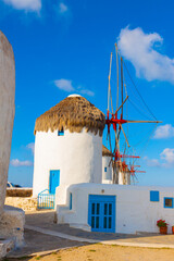 Windmills lined up closeup in Mykonos island cyclades Greece - 440253447