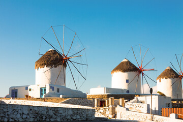 Windmills midrange shoot with blue sky in Mykonos island cyclades Greece - 440253482