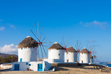 Windmills view in a row with bluew sky in Mykonos island cyclades Greece - 440253617