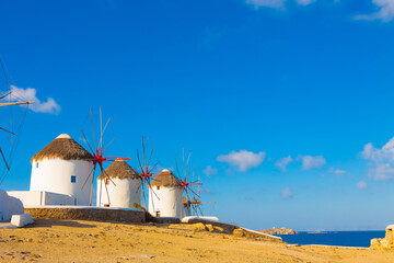 Windmills with blue sky and clouds in Mykonos island cyclades Greece - 440253655