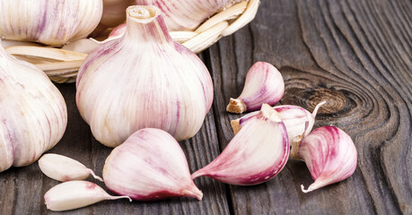 Garlic cloves and garlic bulb on a old wooden table