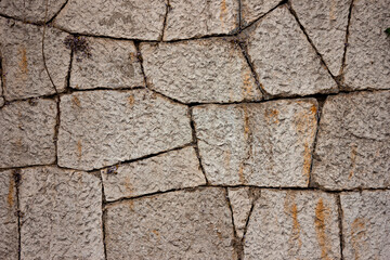 A stone wall. Old stonework. Stone fence.