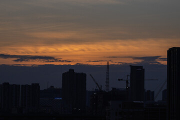 Fototapeta na wymiar sunset over the city orange sky