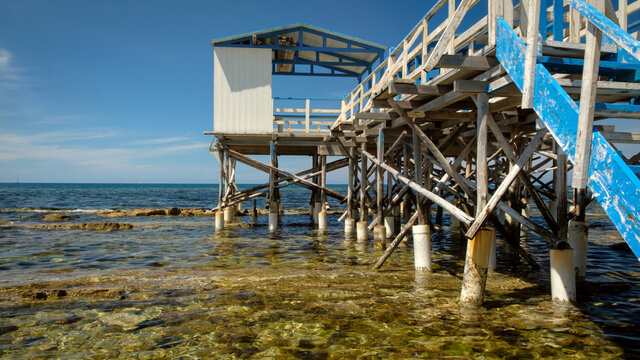 Beach stilt house also called palafitta in the seaside of Santa Marinella , Rome , Italy