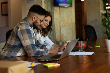  Colleagues in office. Businesswoman and businessman discussing work in office