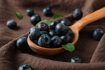 Fresh berry concept with blueberry on kitchen towel background