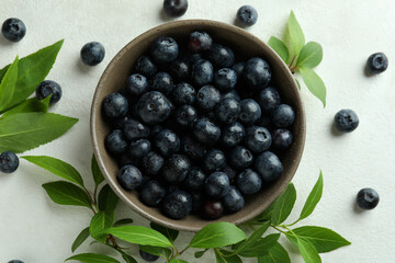 Fresh berry concept with blueberry on white textured table
