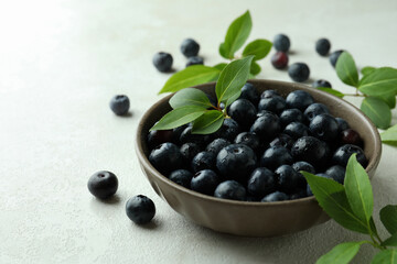 Fresh berry concept with blueberry on white textured table
