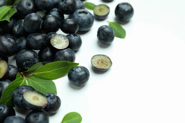 Fresh blueberry with leaves on white background