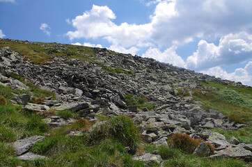 Mountain panoramic landscape with clouds and blue sky