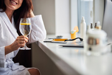 Relaxed woman preparing for her beauty procedure