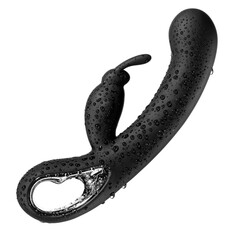 Black vaginal vibrator in drops of water hanging in the air isolated on a white background
