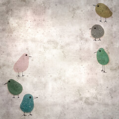 stylish textured old paper background with funny little penguins made of sea glass pebble pieces 