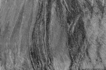 Black and white background. Gray rock texture. Grunge stone background. The texture of the mountains. Close-up. Grunge banner with volumetric rock texture