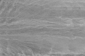 Black and white background. Gray rock texture. Grunge stone background. The texture of the mountains. Close-up. Grunge banner with volumetric rock texture