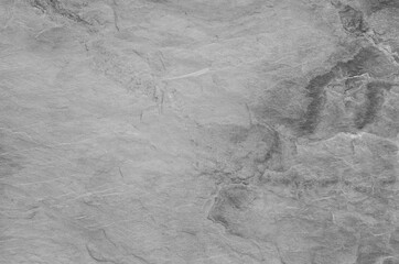 Black and white background. Gray rock texture. Grunge stone background. The texture of the mountains. Close-up. Grunge banner with volumetric rock texture