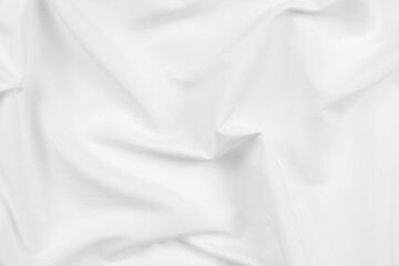 Abstract white fabric texture background. Cloth soft wave. Creases of satin, silk, and cotton.