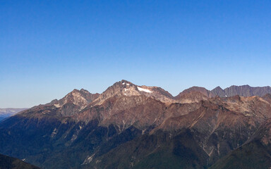 Fototapeta na wymiar daytime landscape in the Caucasian mountains against the blue sky