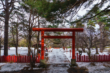 Fototapeta na wymiar Beautiful Architecture Fushimiinari Taisha Shrine Temple in Hokkaido, Japan During winter season.