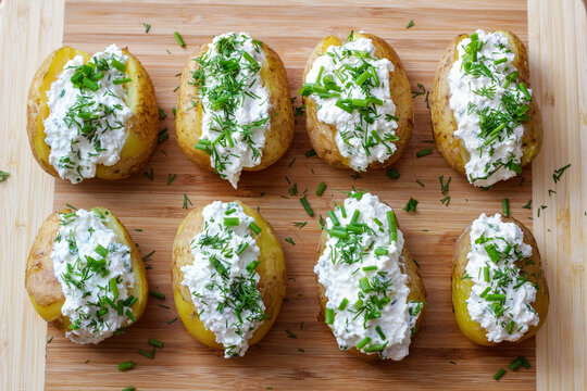 Baked potatoes with cottage cheese paste called "gzik" sprinkled with chives and dill

