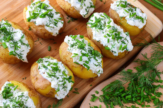 Baked potatoes with cottage cheese paste called "gzik" sprinkled with chives and dill


