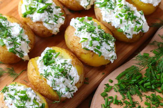 Baked potatoes with cottage cheese paste called "gzik" sprinkled with chives and dill

