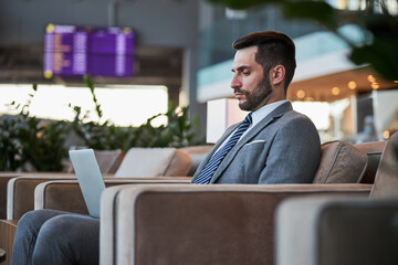 Young businessman concentrated on his work in laptop