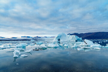 Fototapeta na wymiar The drifting icebergs calved from the thousand years old glacier in Jokulsarlon, Iceland