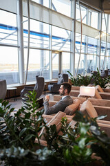 Spacious airport lounge zone with only one visitor