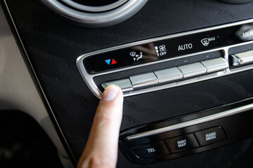 Fototapeta premium hand holding with car climat control 