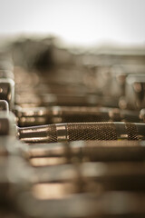 Close up of dumbbells . Row of dumbbells. Gym equipment. Row of dumbbells. fitness center.