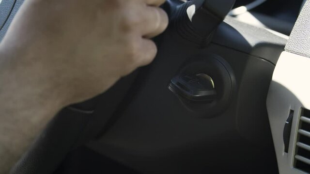 Close-up starting car engine with ignition key