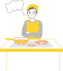 キッチンで何か考えている男性。