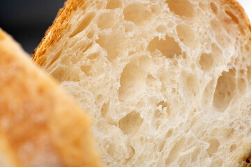 Close-up view of a slice of white homemade bread. 