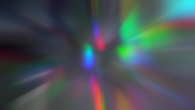 The glow of rainbow holographic chromatic lights zoom. Aura wave abstract background