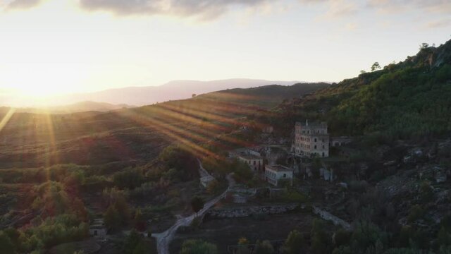 Drone aerial panorama of Termas Radium Hotel Serra da Pena at sunset in Sortelha, Portugal