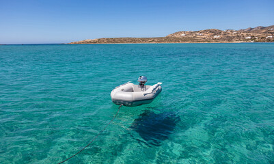 Dinghy Inflatable boat on turquoise blue sea water
