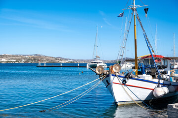 Fishing boat anchored at Milos island harbor. Greece