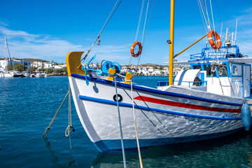 Fishing boat anchored at Milos island harbor. Greece