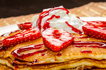 Pancake with strawberries and syrup, breakfast food