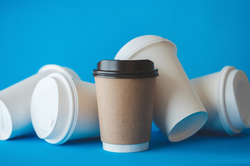 Recycle Brown Paper Coffee Cup Mockup, Take Away Cup for Drinks Isolated on Blue Background with Spilled White Paper Coffee Cups, Paper Coffee Cup Template.