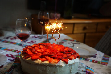 Eighteenth birthday. Number 18 is burning sparklers. Birthday cake.