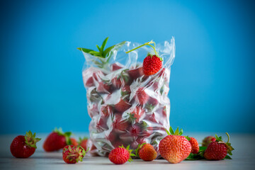 frozen fresh strawberries in a vacuum bag