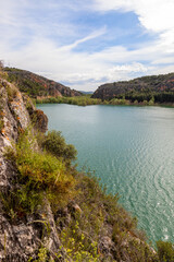 Fototapeta na wymiar Tranquera reservoir situated in Nuévalos, Zaragoza, Aragón, Spain. Beautiful lake with mountains around it.
